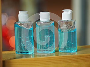 Hand Sanitizer, gel alcoholic mixture with gelatin in clear Plastic bottle with pump pushing wash clean dirty to prevent germs