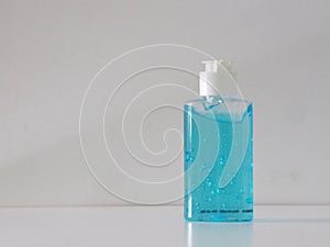 Hand Sanitizer, gel alcoholic mixture with gelatin in clear Plastic bottle with pump pushing, washing clean dirty to prevent germs