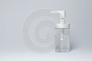 Hand sanitizer glass flask with white dispenser