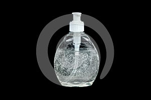 Hand sanitizer liquid soap dispenser isolated on black. Antibacterial alcohol gel bottle with small bubbles