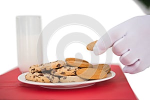 Hand of santa taking cookie