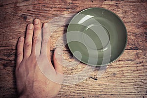 Hand and saucer