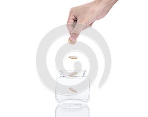 Hand saving money concept,business hand putting money coin stack growing on piggy bank.