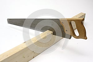 Hand saw cutting wood