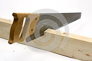 Hand saw cutting wood