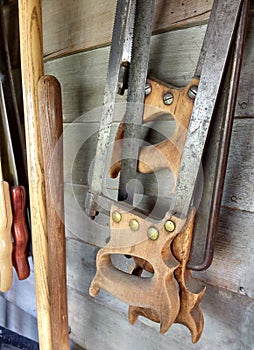 Hand Saws Hanging in a Toolshed photo