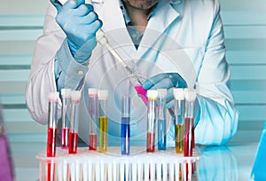 Hand of a scientist pipetting samples in tubes test