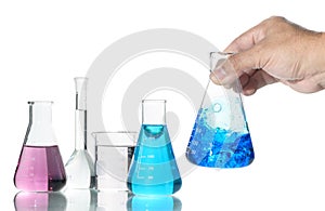 Hand scientist shaking Erlenmeyer flask with blue liquid isolated on white