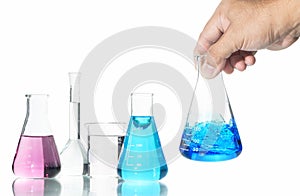 Hand scientist shaking Erlenmeyer flask with blue liquid isolated on white