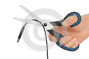 Hand with scissors and computer cable