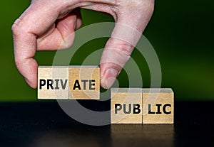 Hand selects cubes with the word private instead of cubes with the word public.
