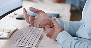Hand, senior man with arthritis and pain from computer, desk, and massage wrist or physical therapy for carpal tunnel