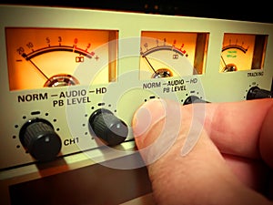 Hand setting audio level photo