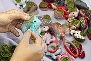 Hand sewing elephant cloth dolls