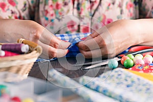 Hand sewing by woman