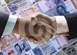 Hand shake background foreign currency