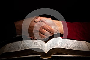 Hand Shake Over the Bible Signaling Religious Understanding