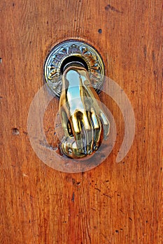 Hand shaped door knob.