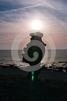 Hand-shaped rock formation on the island of FÃÂ¥rÃÂ¶, sunset, Langhammars RaukomrÃÂ¥de, Sweden, Gotland, Europe photo