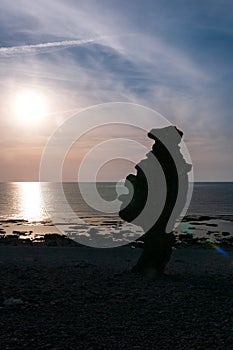 Hand-shaped rock formation on the island of FÃÂ¥rÃÂ¶, sunset, Langhammars RaukomrÃÂ¥de, Sweden, Gotland, Europe photo
