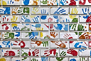 Hand shapes marked on a wall with paint