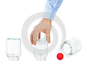 Hand and shell game with glass cans