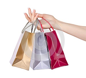 Hand with shopping bags isolated on white