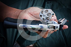 Hand show gun emptied storage cylinder of revolver h