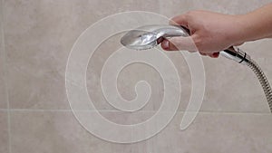 Hand shower head with water jet pressure switch. Hygiene and freshness. Copy space for text