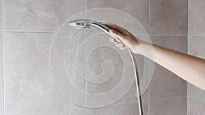Hand shower head with water jet pressure switch. Hygiene and freshness. Copy space for text, spray