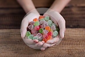 Hand showing pile of gumdrop