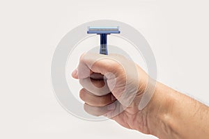 Hand showing a safety razor