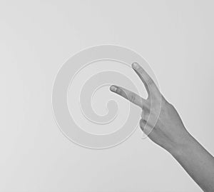 hand showing the sign of victory or peace closeup isolated on white background.Front view. Mock up. Copy space. Template. Blank.