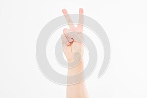 Hand showing the sign of victory or peace closeup isolated on white background.Front view. Mock up. Copy space. Template. Blank