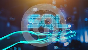 hand showing SQL word and SQL (Structured Query Language) code