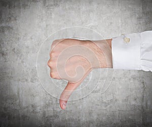 Hand showing thumb down