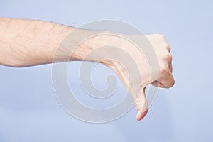 Hand showing thumb down sign