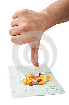 Hand showing thumbs down above a medical prescription