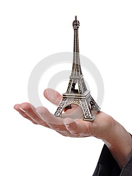 Hand showing a tiny Eiffel Tower