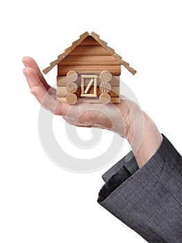 hand showing a wood chalet