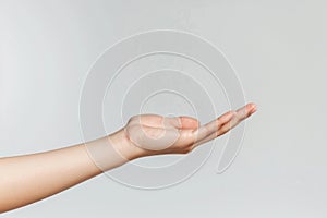 A hand is shown with a white background.Concept of openness and welcoming