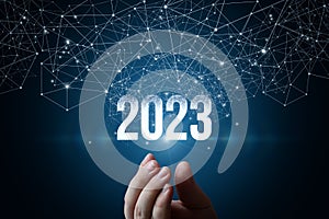 Hand shows new year 2023 appearing from the network