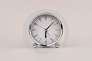 hand shows standing time. High quality studio photo of a clock. The concept of time and the rules of time in work