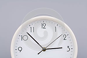 hand shows standing time. High quality studio photo of a clock. The concept of time and the rules of time in work