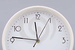 hand shows standing time. High quality studio photo of a clock. The concept of time and the rules of time in work