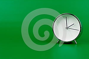 hand shows standing time. High quality studio photo of a clock. The concept of time and the rules of time in work