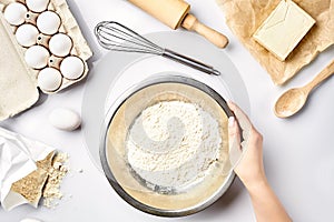 Hand sift flour. Bakery prepare for make cake. Top view