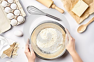 Hand sift flour. Bakery prepare for make cake. Top view