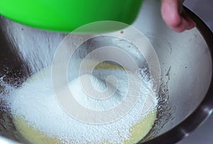 Hand Sift flour, Bakery prepare for make soft cake.