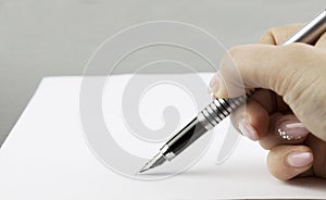 Hand signing a document